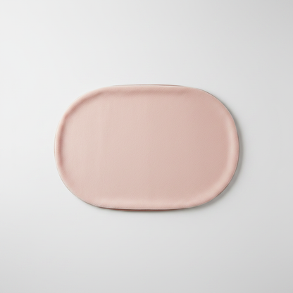 Top-down view of oval pet sleeping mat showing full oval shape and plush texture