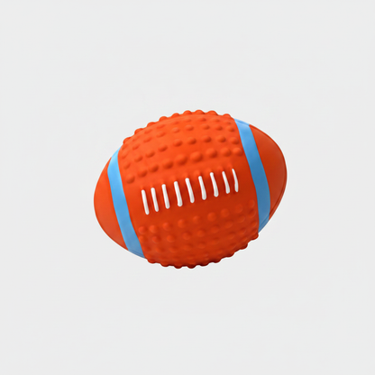 Squeaky rubber dog toy rugby ball in orange and blue with textured ridges